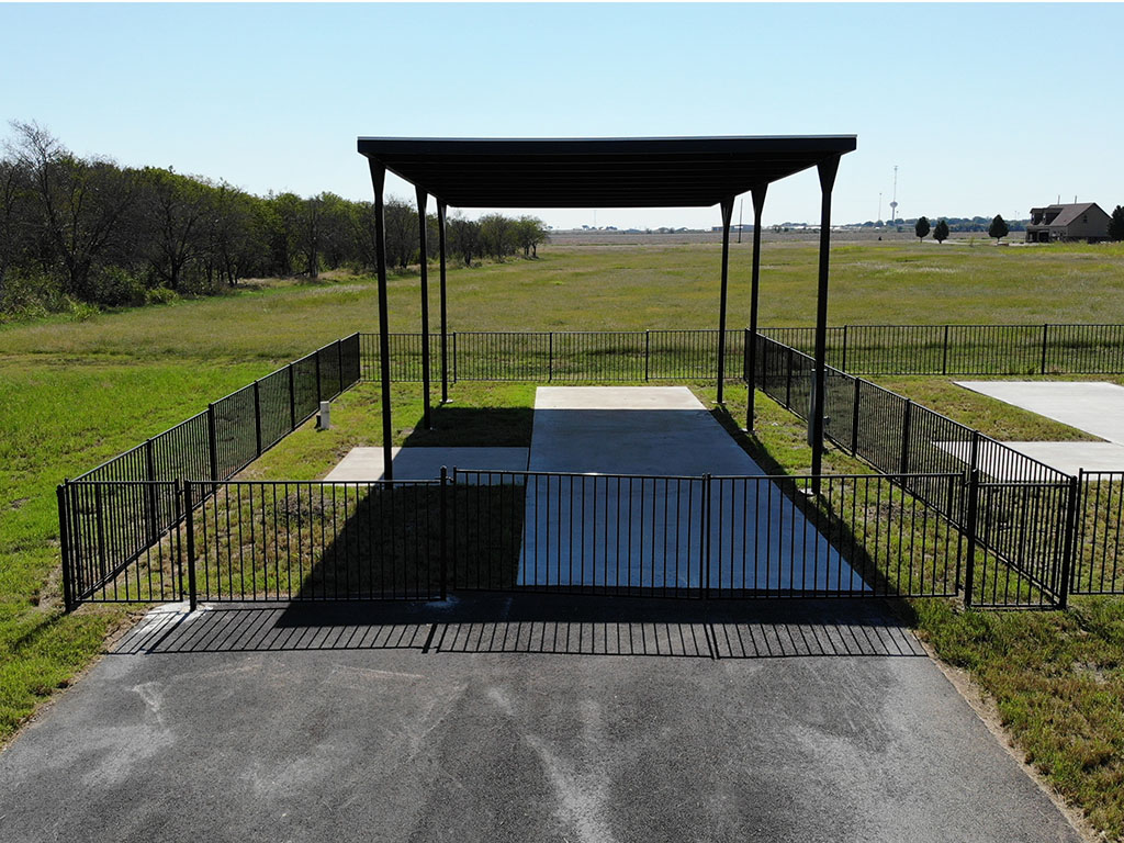 Fenced and Covered RV Site at Itasca Creek RV Park in Itasca, TX