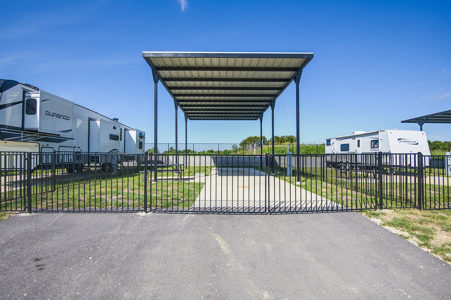 Covered RV Site at Itasca Creek RV Park in Itasca, TX